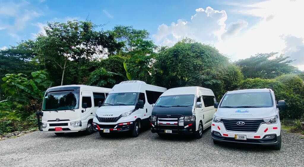 http://Private%20Costa%20Rica%20airport%20transportation%20vans%20parked%20in%20a%20lush%20tropical%20setting